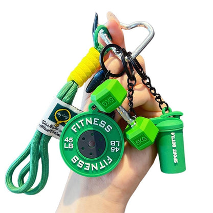 Waarom deze kleine barbell-sleutelhanger jou gaat motiveren