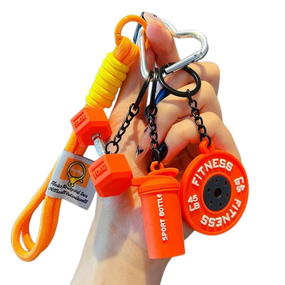 Waarom deze kleine barbell-sleutelhanger jou gaat motiveren